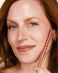Model wearing LipSense Long-Lasting Lip Liner Pencil product shade Nude.