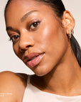 Model wearing Contouring Bronzer Cream product shade Deep Terra