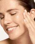 Model applying SeneGence Microbiome Boosting Serum product.