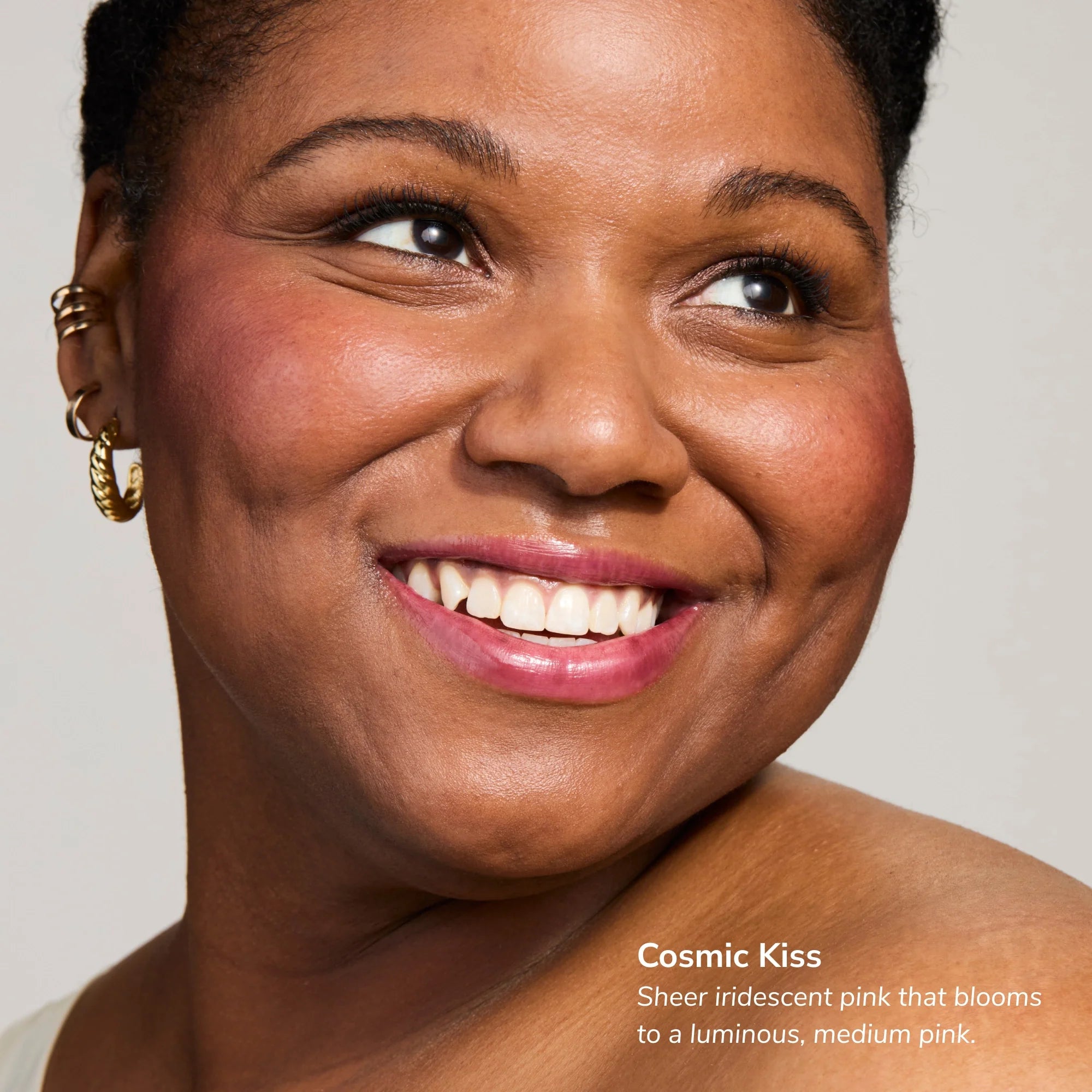 Smiling woman with radiant pink lips representing Cosmic Kiss shade from Glowify Mood Ring duo
