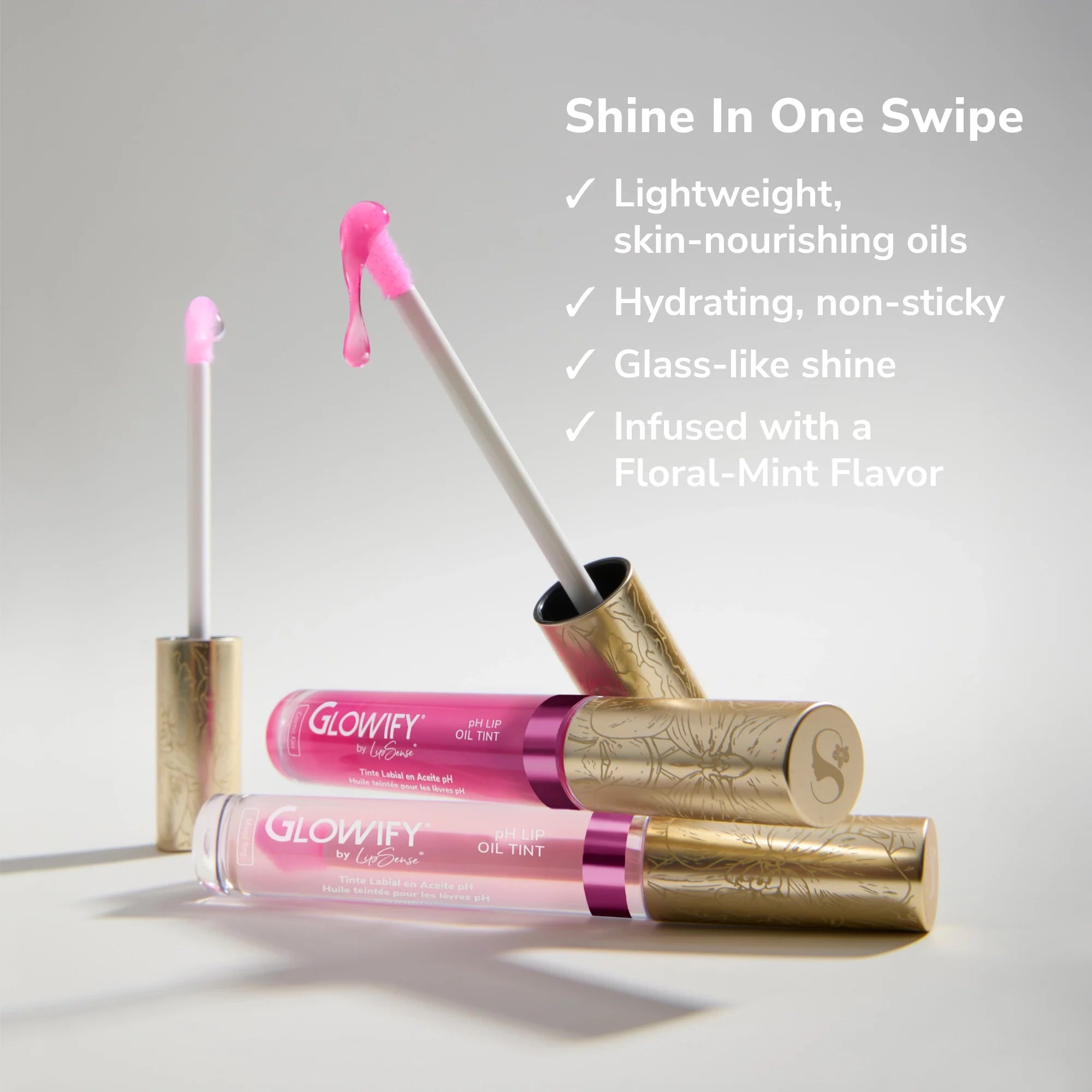 Glowify Mood Ring Duo lip oil tint product shot with two pink tubes and gold caps