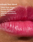 Close-up of glossy pink lips wearing Glowify pH Lip Oil Tint Mood Ring Duo product