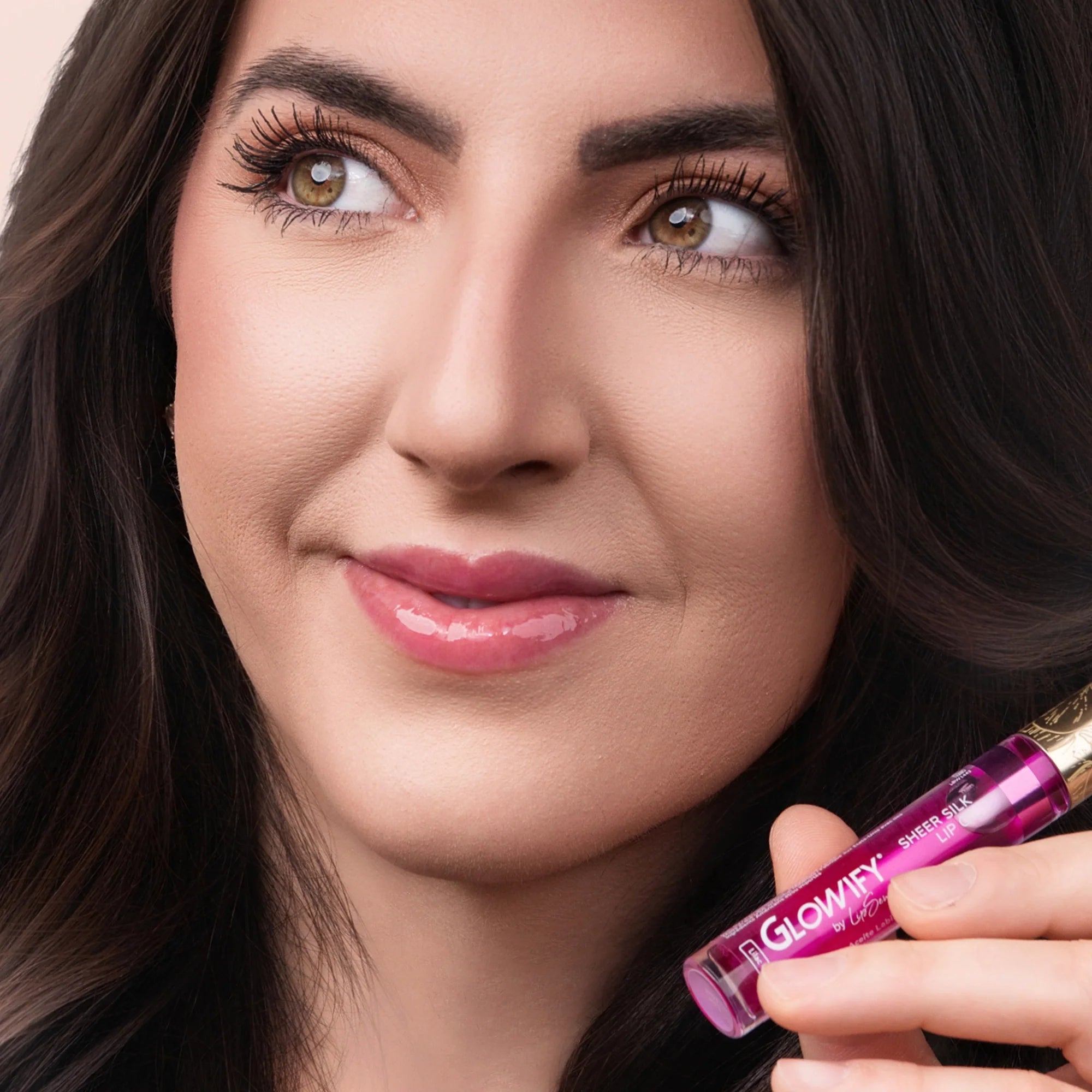 Model wearing Glowify Sheer Silk Lip Oil product shade Lilac Mist.