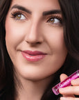 Model wearing Glowify Sheer Silk Lip Oil product shade Lilac Mist.
