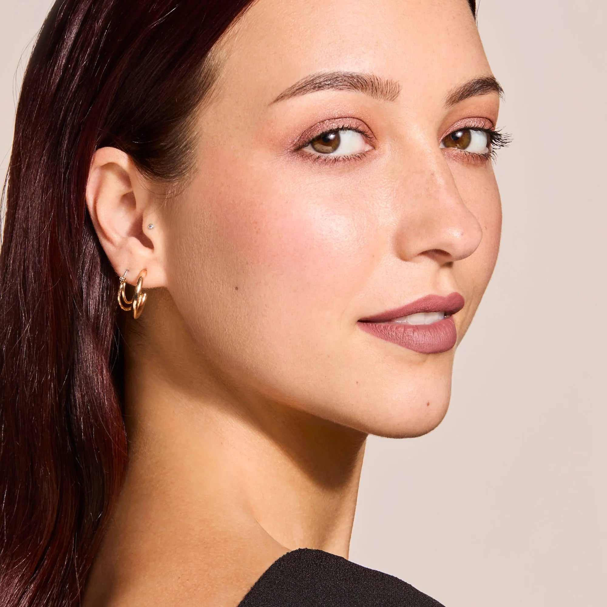 Model wearing LipSense Cream product shade Bella.