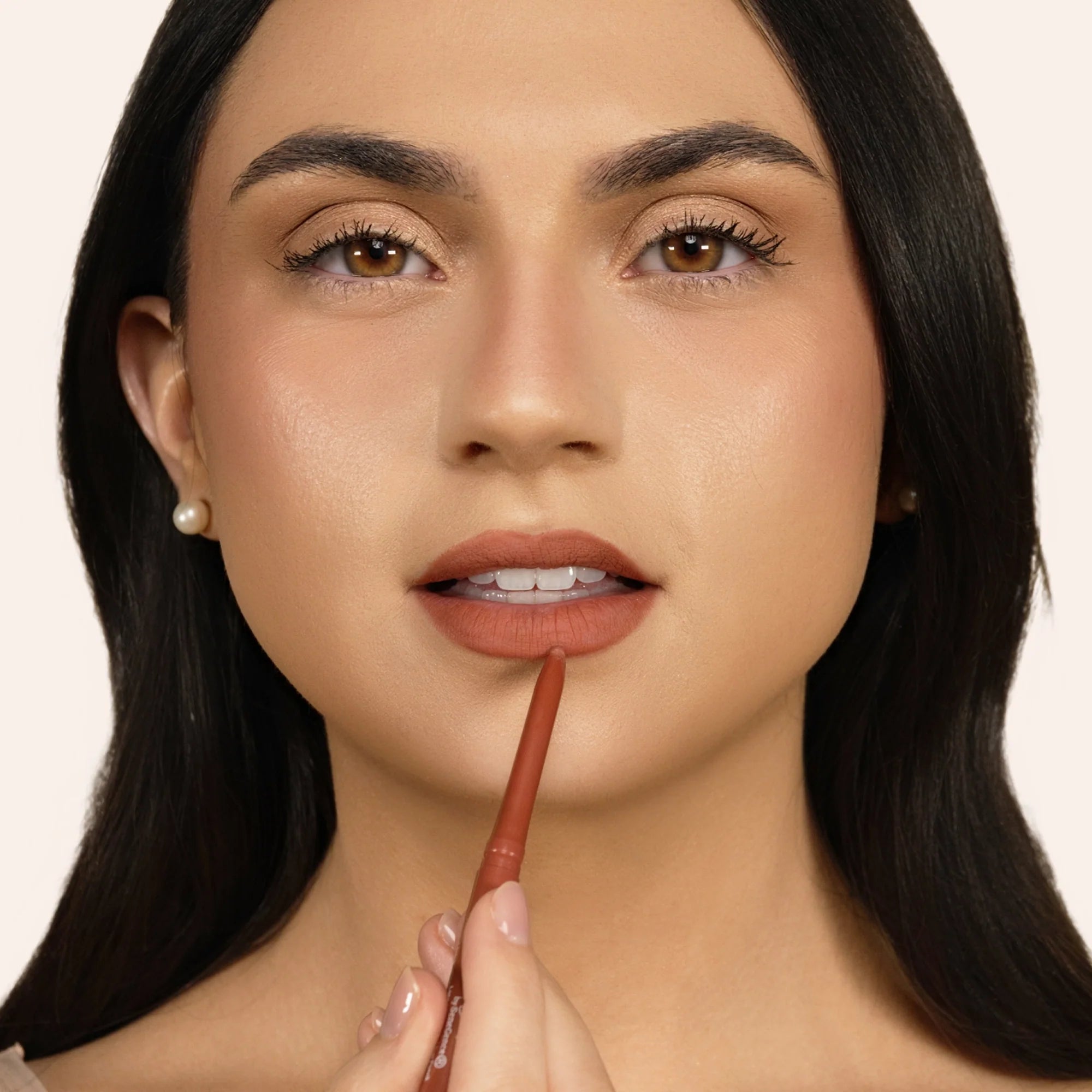 Model applying LipSense Long-Lasting Lip Liner Pencil product shade Rustic Maple.
