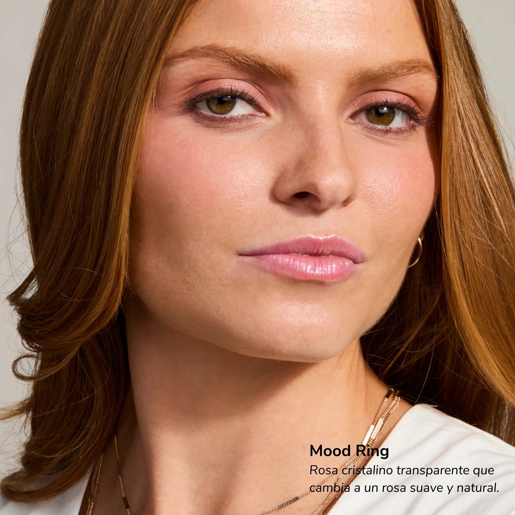 Portrait of a woman with soft pink lipstick and natural makeup showcasing Mood Ring lip tint
