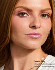 Portrait of a woman with soft pink lipstick and natural makeup showcasing Mood Ring lip tint