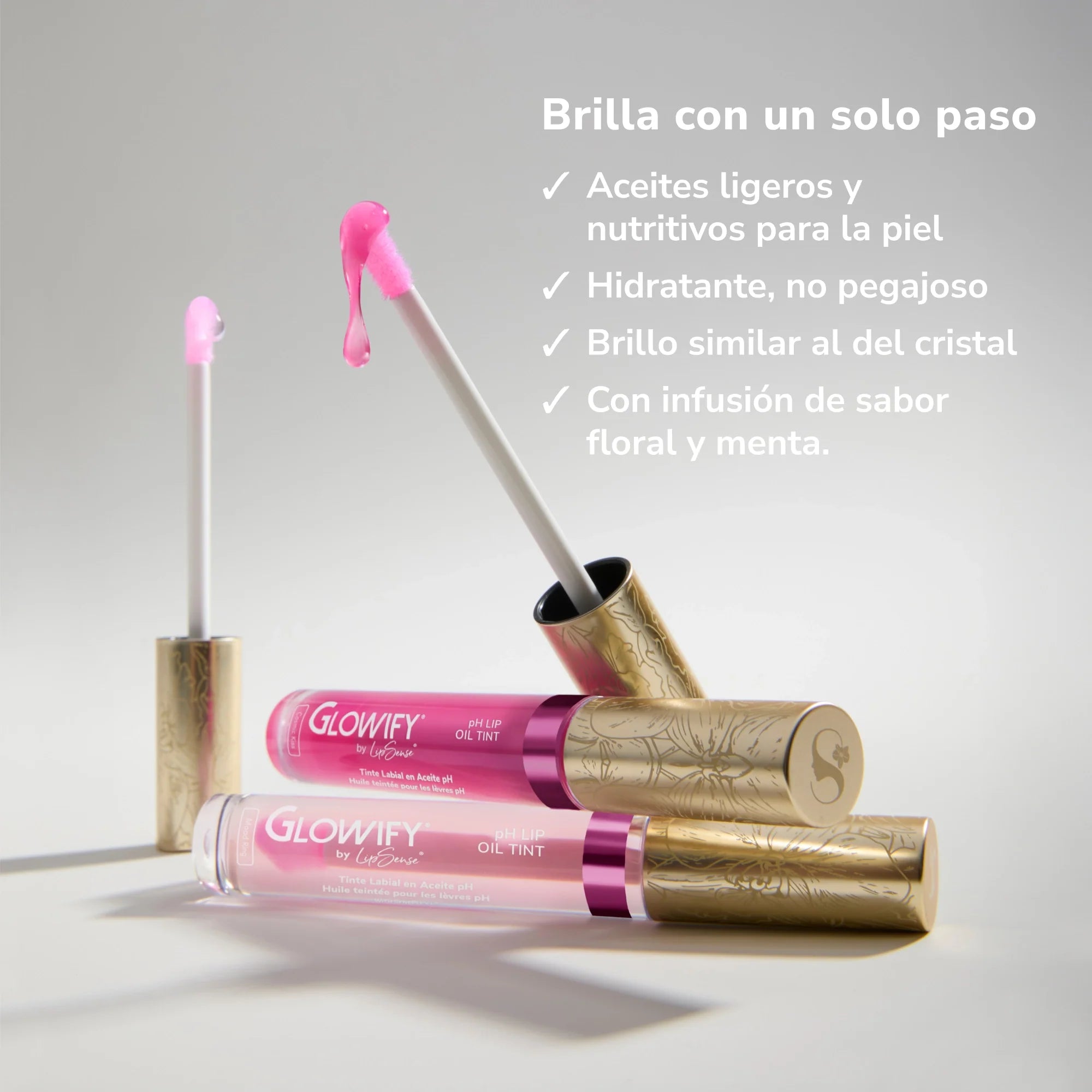 Glowify pH Lip Oil Tint Mood Ring Duo MX bottles with pink gloss and gold patterned caps