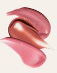 Swatches of three LipSense shades in pink nude and rose on a pale background