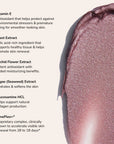 Creamy shimmery pink swatch on beige background with Vitamin E skincare ingredient list.