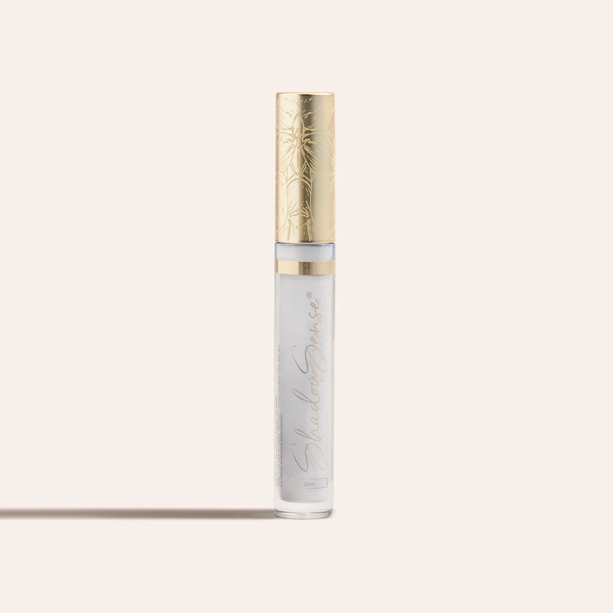 ShadowSense Eyeshadow NZL in a slender clear tube with pale lavender shimmer and a decorative gold cap
