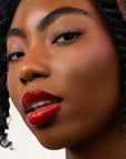 Model wearing LipSense Lip Color shade Red Rose product