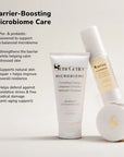 Barrier boosting microbiome care set with a cleansing tube and a serum bottle displayed against a soft beige background.