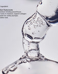 Close-up of a clear viscous liquid being poured with bubbles, highlighting Sodium Hyaluronate as a key ingredient.