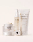 SeneGence Microbiome Regimen Set MX with cream in a jar serum bottle and cleanser tube on a pale background