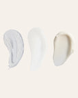 Three texture swatches representing cleanser serum and moisturizer on a light beige background