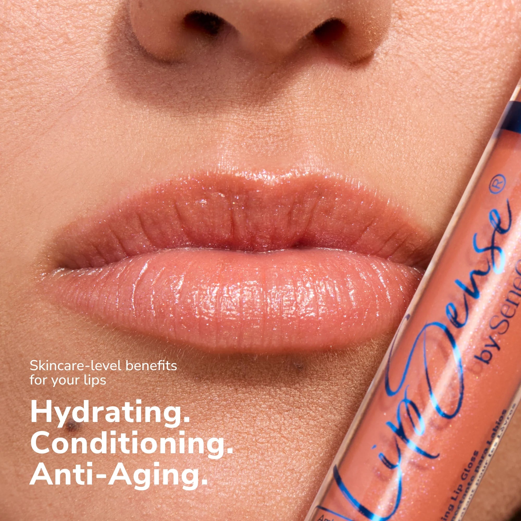 Close up of glossy lips with a LipSense gloss tube beside them showing a peachy shade