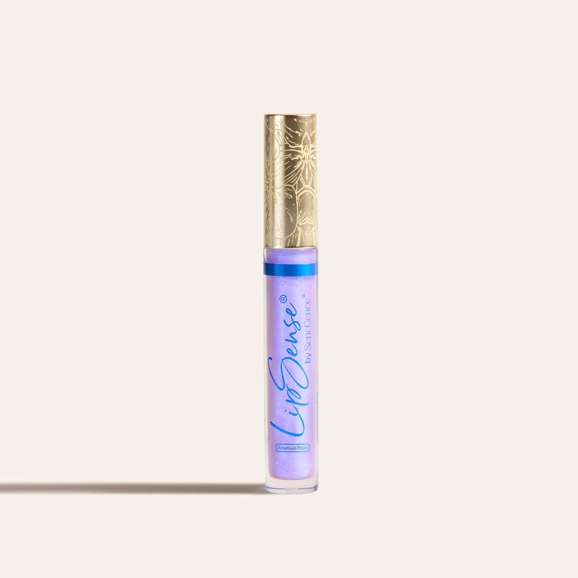 LipSense moisturizing gloss in lavender shade in a clear tube with an ornate gold cap