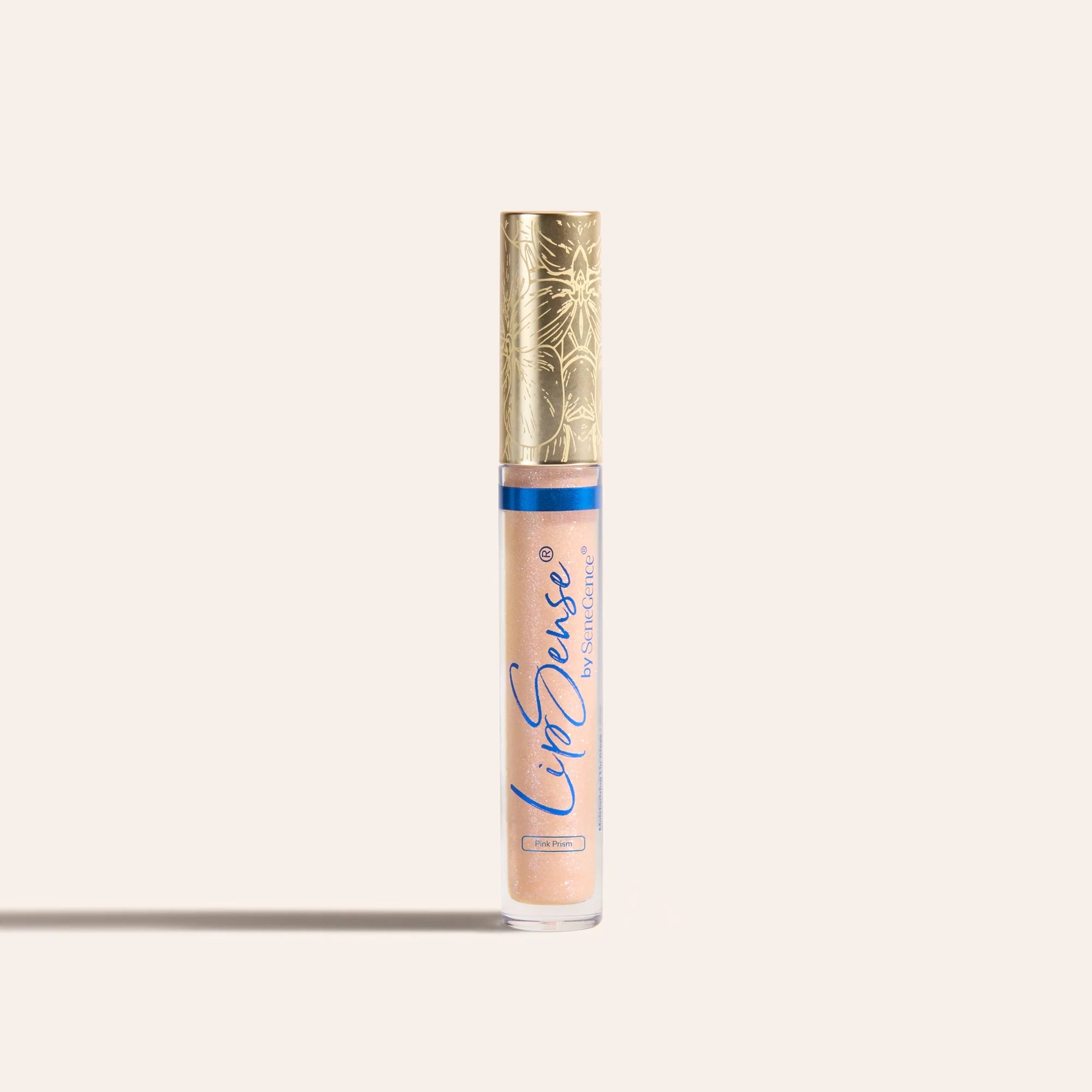 LipSense moisturizing gloss in peach pink shade in a clear tube with an ornate gold cap