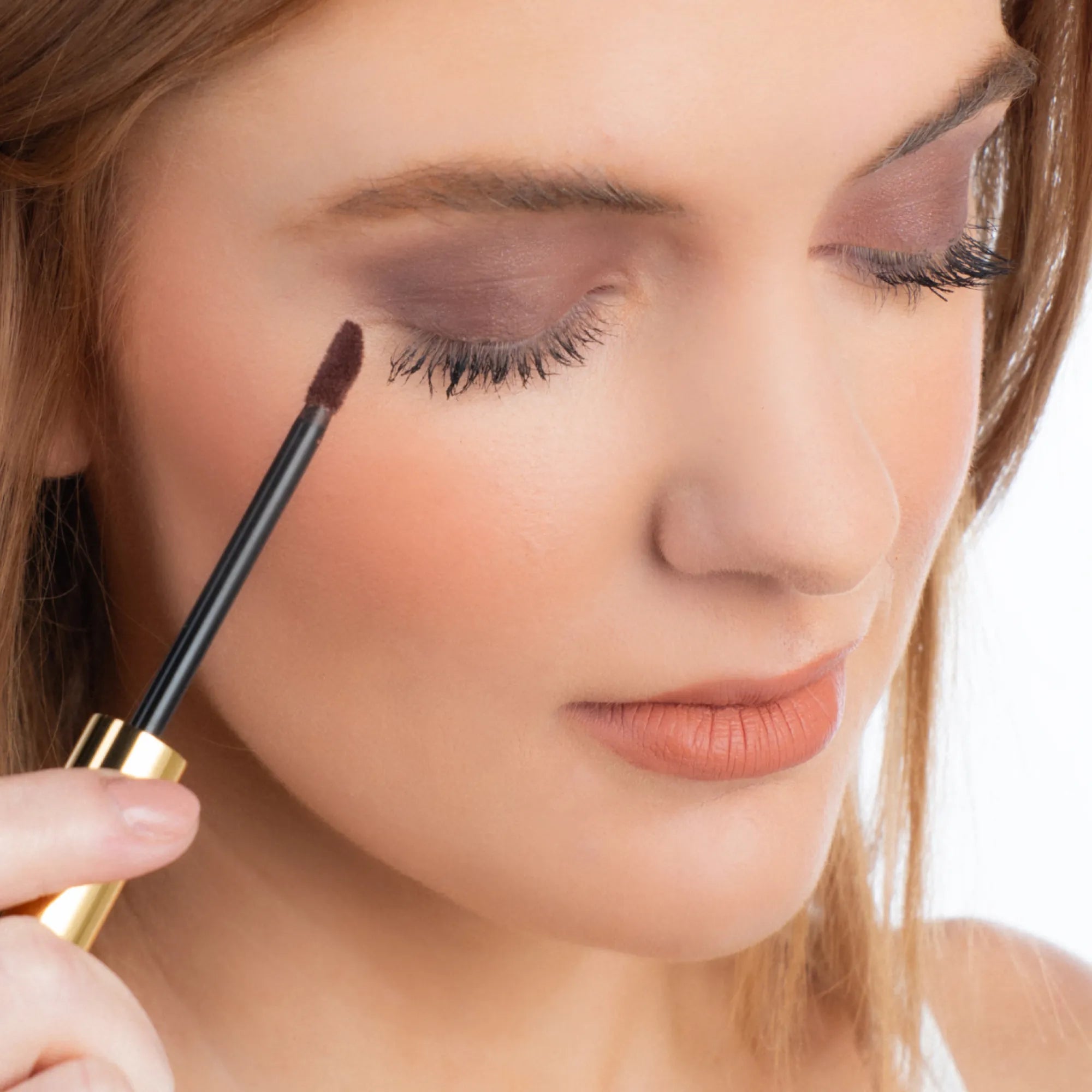 Model wearing ShadowSense product shade Garnet